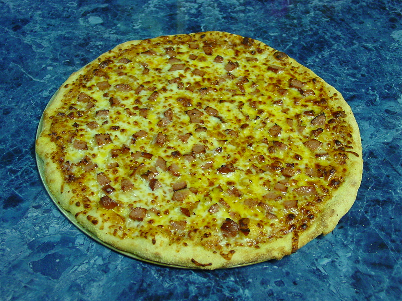 2nd BEST SELLING PIZZA, WITH ECKRICH SMOKED SAUSAGE, CHEDDAR, AMERICAN & MOZZARELLA CHEESE AND SWEET BABY RAYS BAR B Q SAUCE